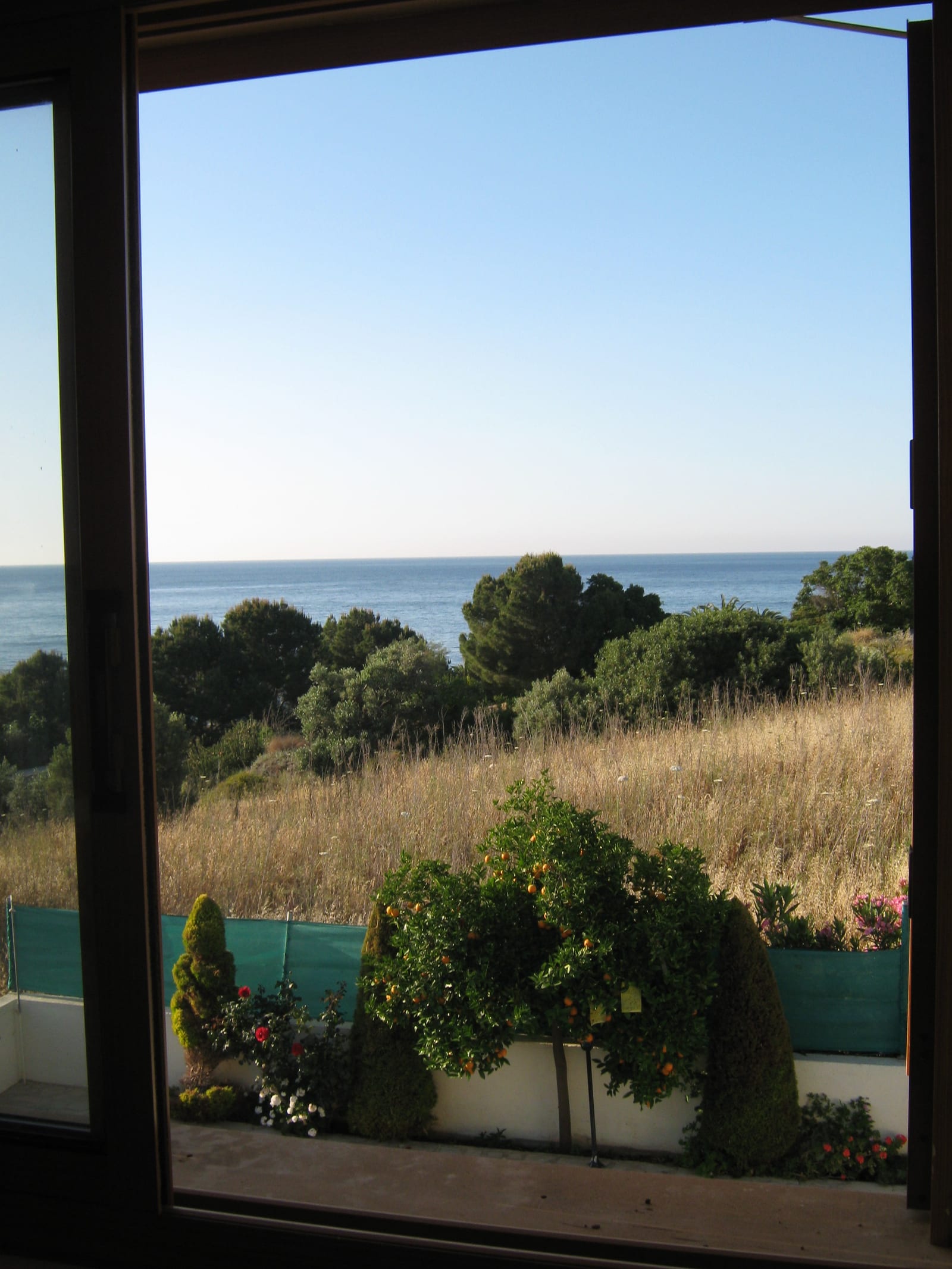 An upstairs bedroom looking out towards the sea